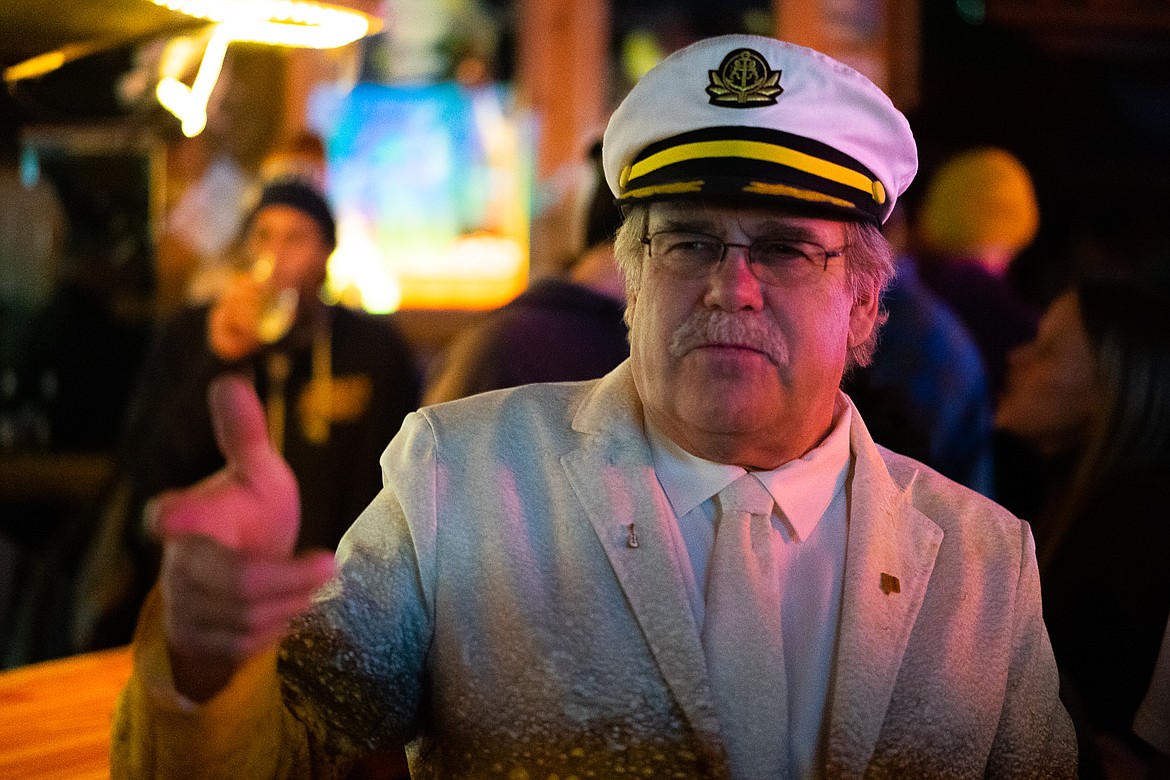 An enthusiastic captain shoots finger guns during the Great Northern Bar and Grill&#146;s 100th anniversary celebration on Saturday. (Daniel McKay/Whitefish Pilot)