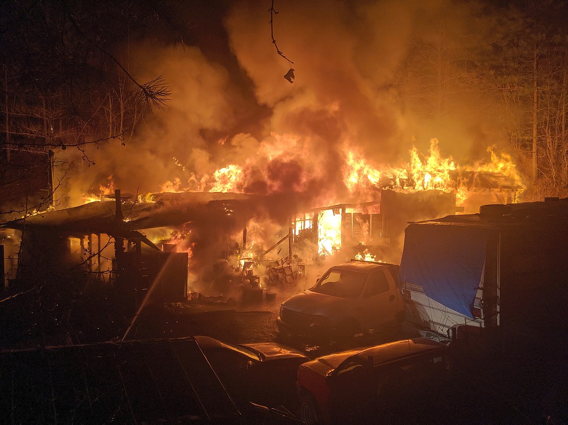 A wide shot of the original structures on fire. When crews arrived on scene, these buildings were already completely engulfed.