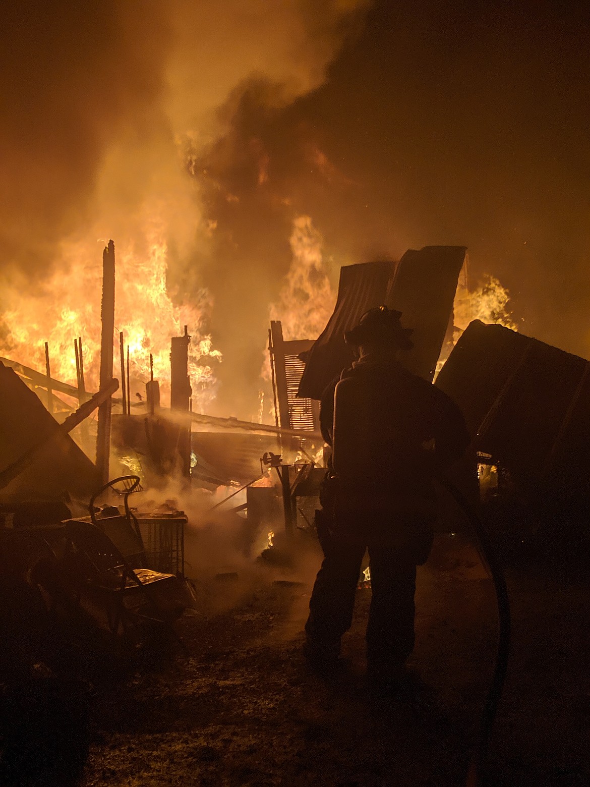 A SCFD No. 2 firefighter attacks the center of the blaze.