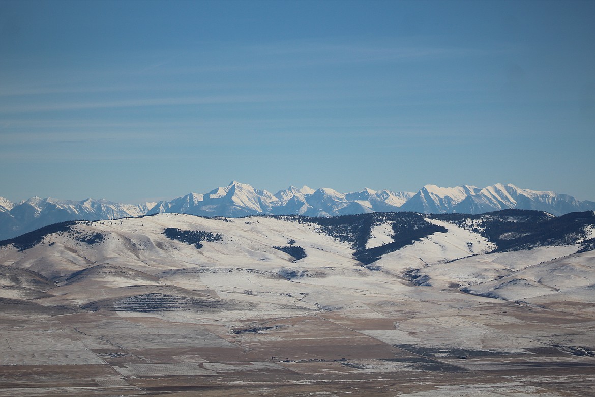 THE VIEW of the Mission mountains from the eastern side of Sanders County, over the Camus Prarie Valley. (John Dowd/ Clark Fork valley Press)