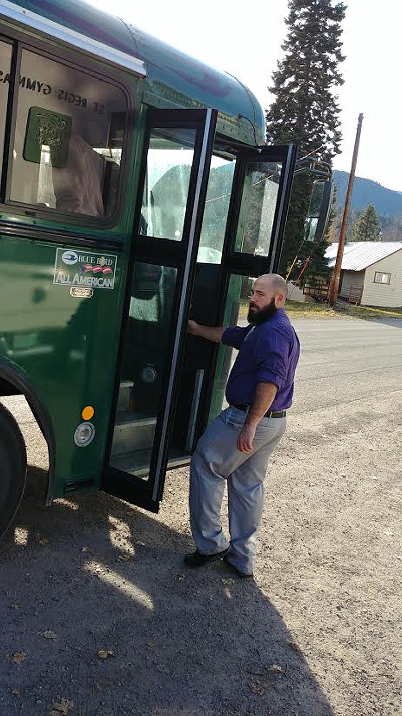 St. Regis football coach Jessie Allen prepares to board the bus and drive his team to Idaho for a state playoff game. (Chuck Bandel/Mineral Independent)