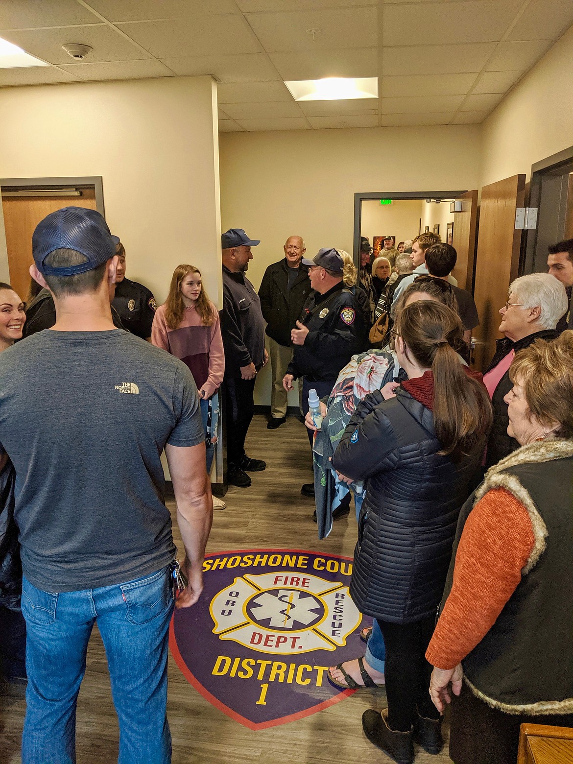 Photo by CHANSE WATSON
Open house attendees meet in the front entryway of the new firehouse as they move from room to room.