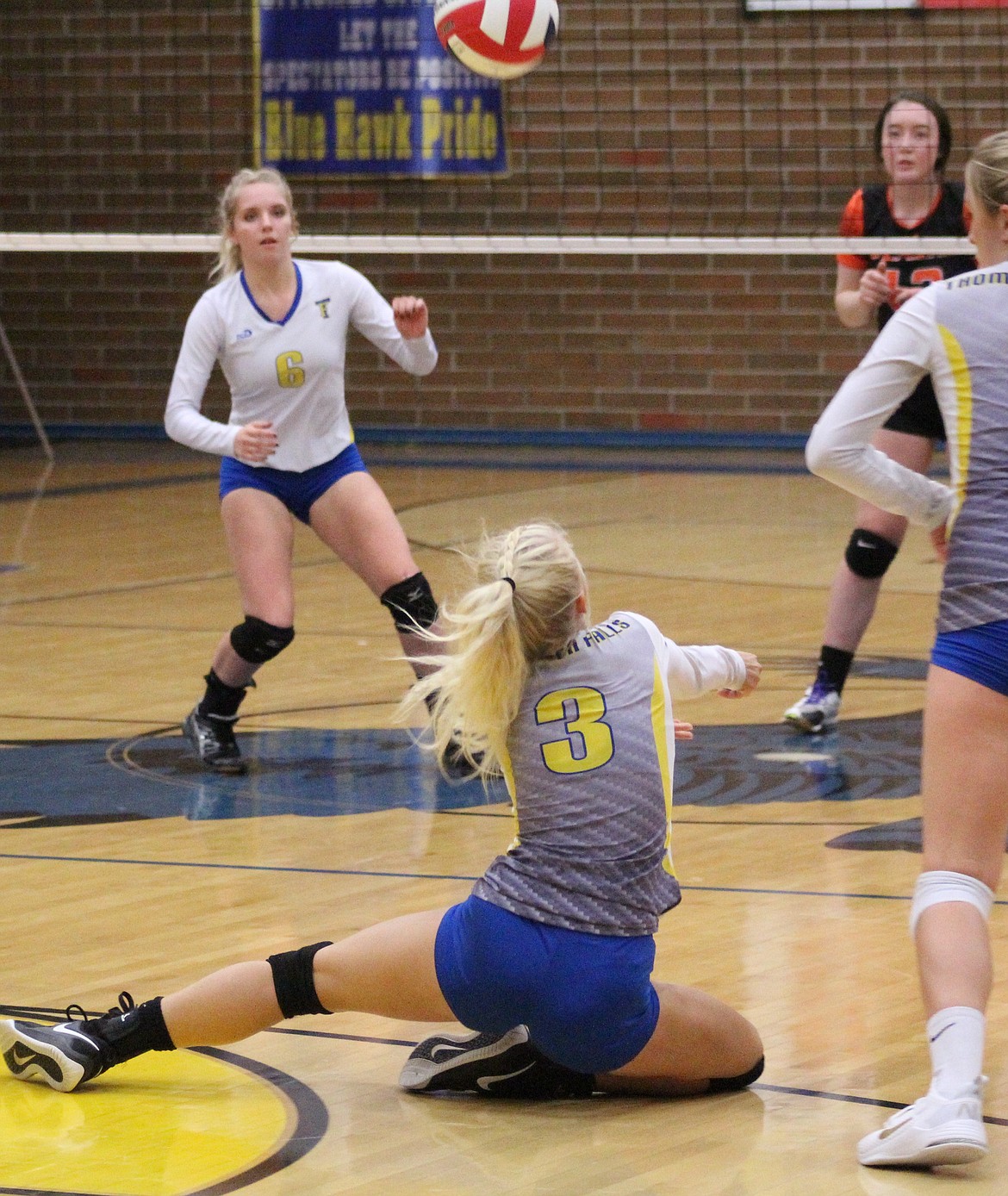 SCARLETTE SCHWINDT from Thompson Falls (3) sliding in to dig a spike from Plains in this file photo from Tuesday, Sep. 17. (John Dowd/Clark Fork Valley Press)