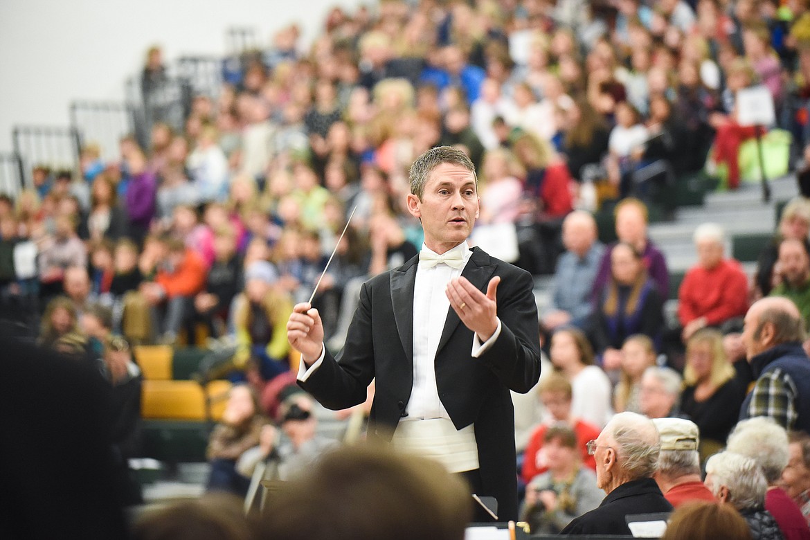 Mark McCrady conducts the high school band during Monday&#146;s Veterans Day Assembly at Whitefish High School. (Daniel McKay/Whitefish Pilot)