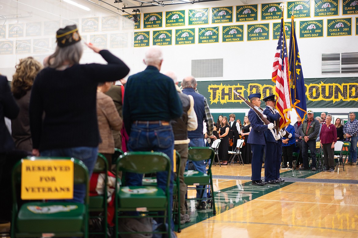 Veterans in attendance salute the Flathead Composite Squadron, Civil Air Patrol as they retire the colors during Monday&#146;s Veterans Day Assembly at Whitefish High School. (Daniel McKay/Whitefish Pilot)