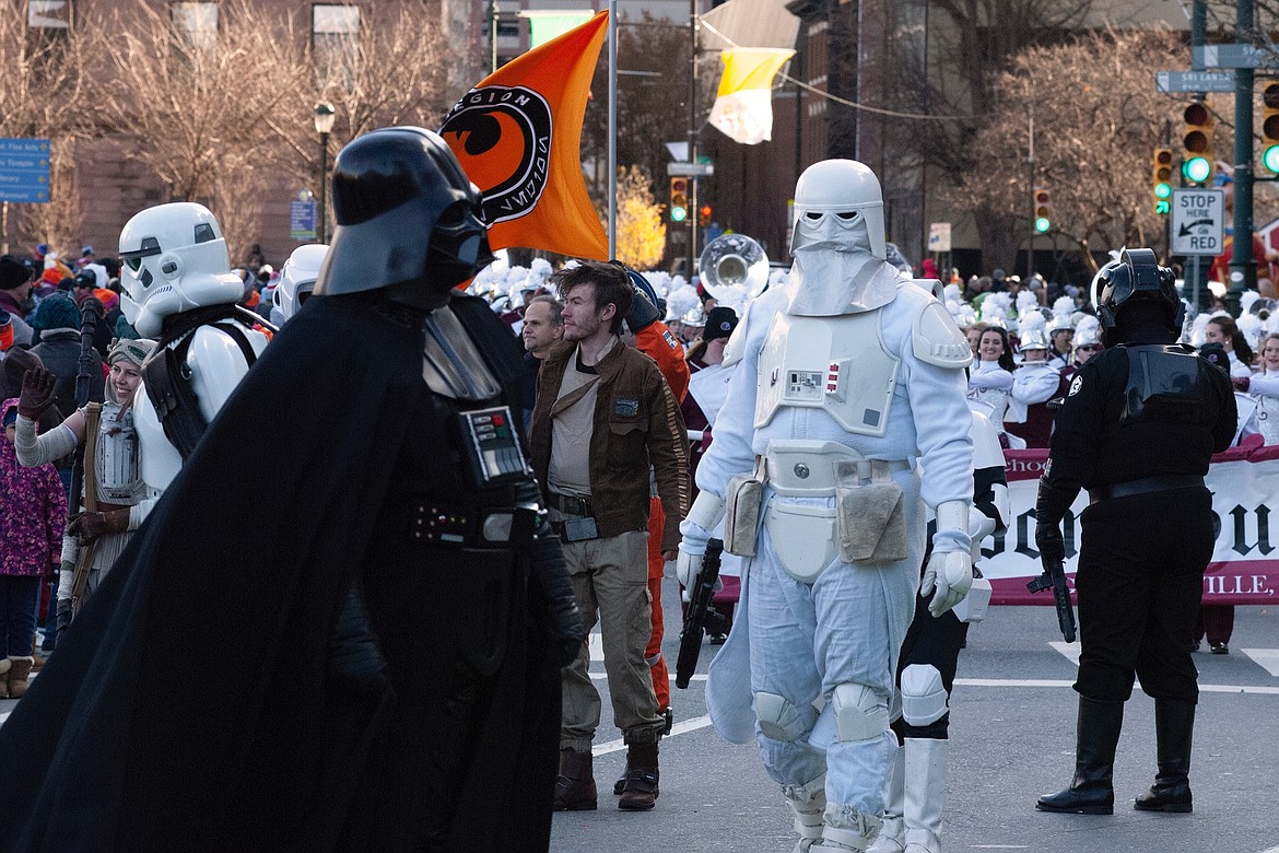 The 501st Legion, a group that portrays Star Wars villains, marched with Rebel Legion, a similar group that glorifies the saga&#146;s heroes. (JIM MOWREADER/Press)