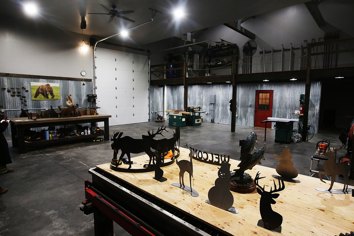 Some of Jeff May's artwork inside his new workshop. The original workshop was destroyed in a fire. May has added a sink, good lighting, an electric heater, and a door to the carving area. (LOREN BENOIT/Press)