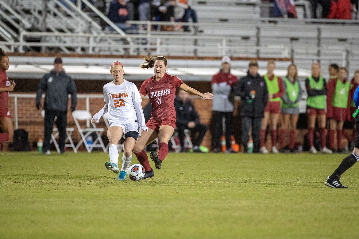 Photo courtesy WSU MEDIA RELATIONS
Bridget Rieken, right, of Washington State vies with Meghan McCool of Virginia for the ball last Friday.