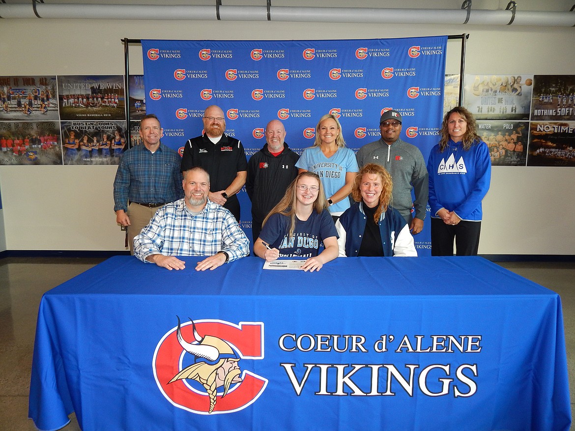 Courtesy photo
Coeur d&#146;Alene High senior Elly Schraeder recently signed a letter of intent to play volleyball at the University of San Diego. Seated from left is Jeff Schraeder (dad), Elly Schraeder and Asheley Schraeder (mom); and standing from left, Mike Randles, Coeur d&#146;Alene High athletic director; Trent York, club volleyball coach; Shaune Montgomery, club coach; Kari Chavez, club coach; Rob White, club director; and Carly Curtis, Coeur d&#146;Alene High volleyball coach.