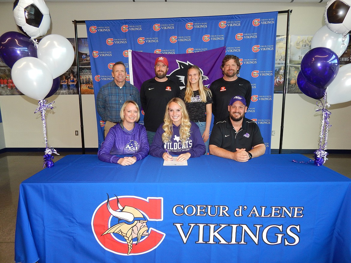 Courtesy photo
Coeur d&#146;Alene High senior Lily Foster recently signed a letter of intent to play soccer at Abilene Christian University in Abilene, Texas. Seated from left are Lynsey Foster (mom), Lily Foster and Bruce Foster (dad); and standing from left, Mike Randles, Coeur d&#146;Alene High athletic director; Nick Funkhouser, club soccer coach; Molly Foster, sister; and Julio Morales, club soccer coach.