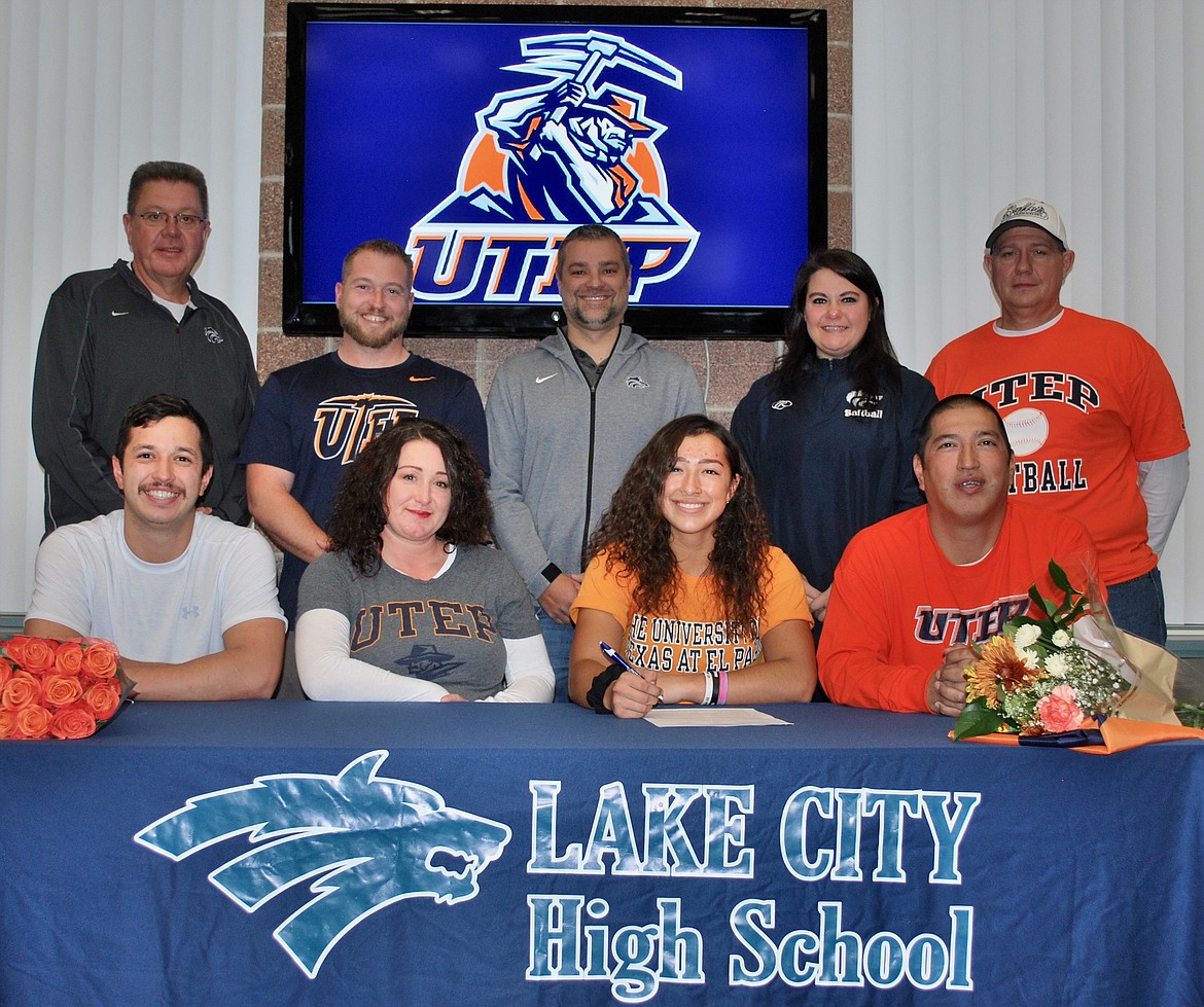 Courtesy photo
Lake City High senior Ashlynn Allen recently signed a letter of intent to play softball at UTEP. Seated from left are Austin Allen (brother), Ruth Leatham (mom), Ashlynn Allen and Michael Allen (dad); and standing from left, Jim Winger, Lake City High athletic director; Bryant Sampson; Bryan Kelly, Lake City High assistant principal; Alysha Krier, Lake City High assistant softball coach; and Dwayne Currie.