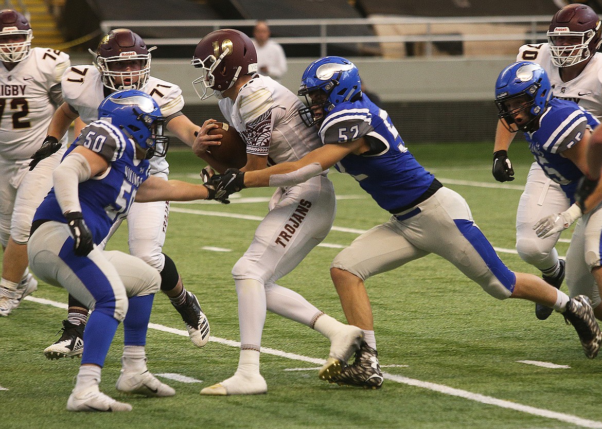 Coeur d&#146;Alene&#146;s Carter Wiebusch tackles Rigby quarterback Keegan Thompson.