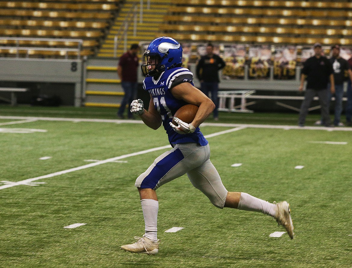 Coeur d&#146;Alene&#146;s Colbey Nosworthy runs the ball upfield against Rigby in the 5A Idaho State Championship game Saturday at the Kibbie Dome. (LOREN BENOIT/Press)