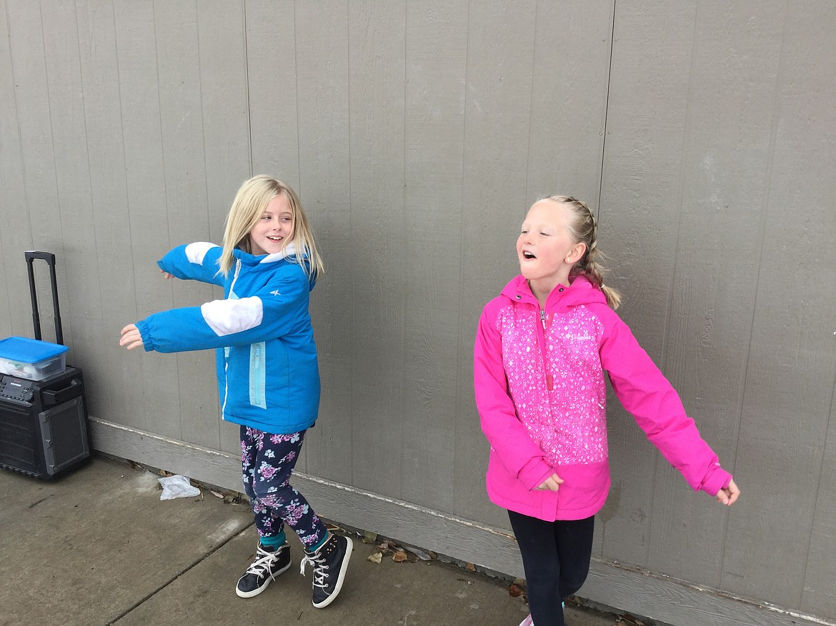 Kendall Hoffman, left, and Tatianna Charbonneau, have fun during recess at East Evergreen Elementary School.
