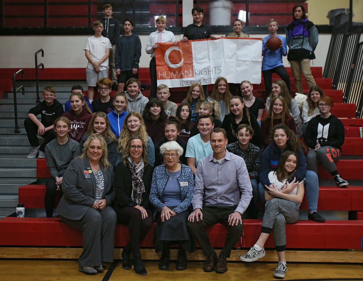 Tara Nelson's eighth-grade language arts students spent the morning with Holocaust survivor Carla Peperzak is seated front and center with (from left) Human Rights Education Institute executive director Jeanette Laster, Nelson, Canfield Principal Nick Lilyquist and Tara Nelson's eighth grade language arts class. (DEVIN WEEKS/Press)