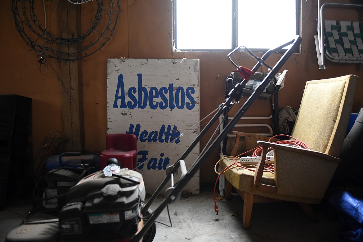 Old signage for an asbestos health fair in Gayla Benefield&#146;s garage in Libby on Nov. 12. (Casey Kreider/Daily Inter Lake)