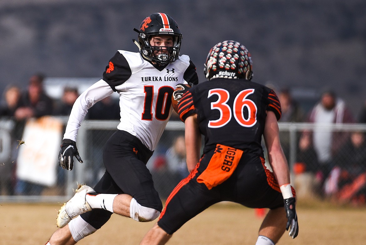 Eureka wide receiver Austin Sartori (10) looks to get past Manhattan defensive back Kyle Hotvedt (36) on an end-around in the Class B State Championship in Manhattan on Saturday. Eureka defeated Manhattan, 20-6. (Casey Kreider/Daily Inter Lake)