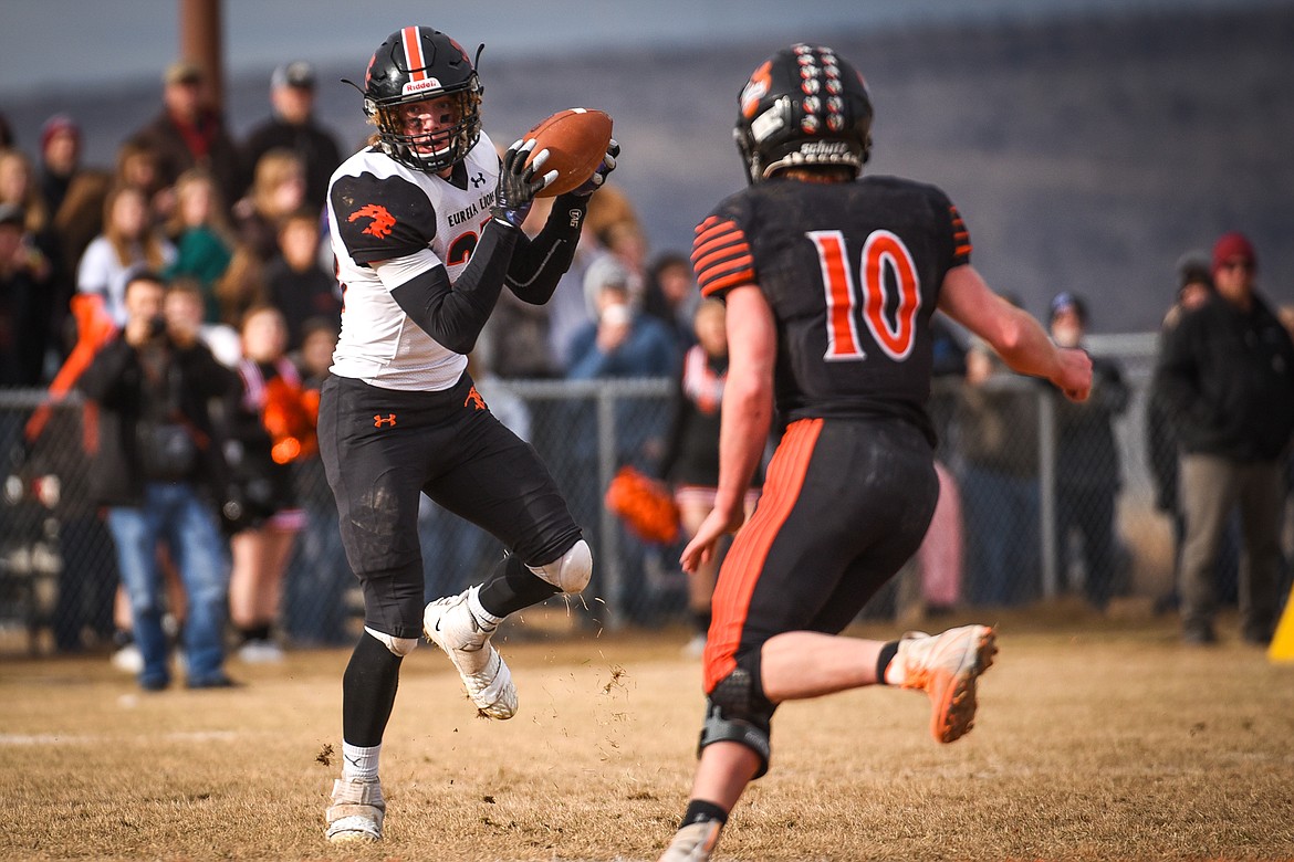 Eureka tight end Cory Chaney (25) looks upfield after making a reception in the second quarter against Manhattan in the Class B State Championship in Manhattan on Saturday. Eureka defeated Manhattan, 20-6. (Casey Kreider/Daily Inter Lake)