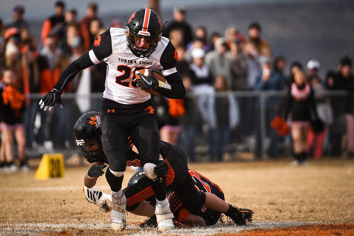 Eureka tight end Cory Chaney (25) sheds tackles after a reception in the second quarter against Manhattan in the Class B State Championship in Manhattan on Saturday. Eureka defeated Manhattan, 20-6. (Casey Kreider/Daily Inter Lake)