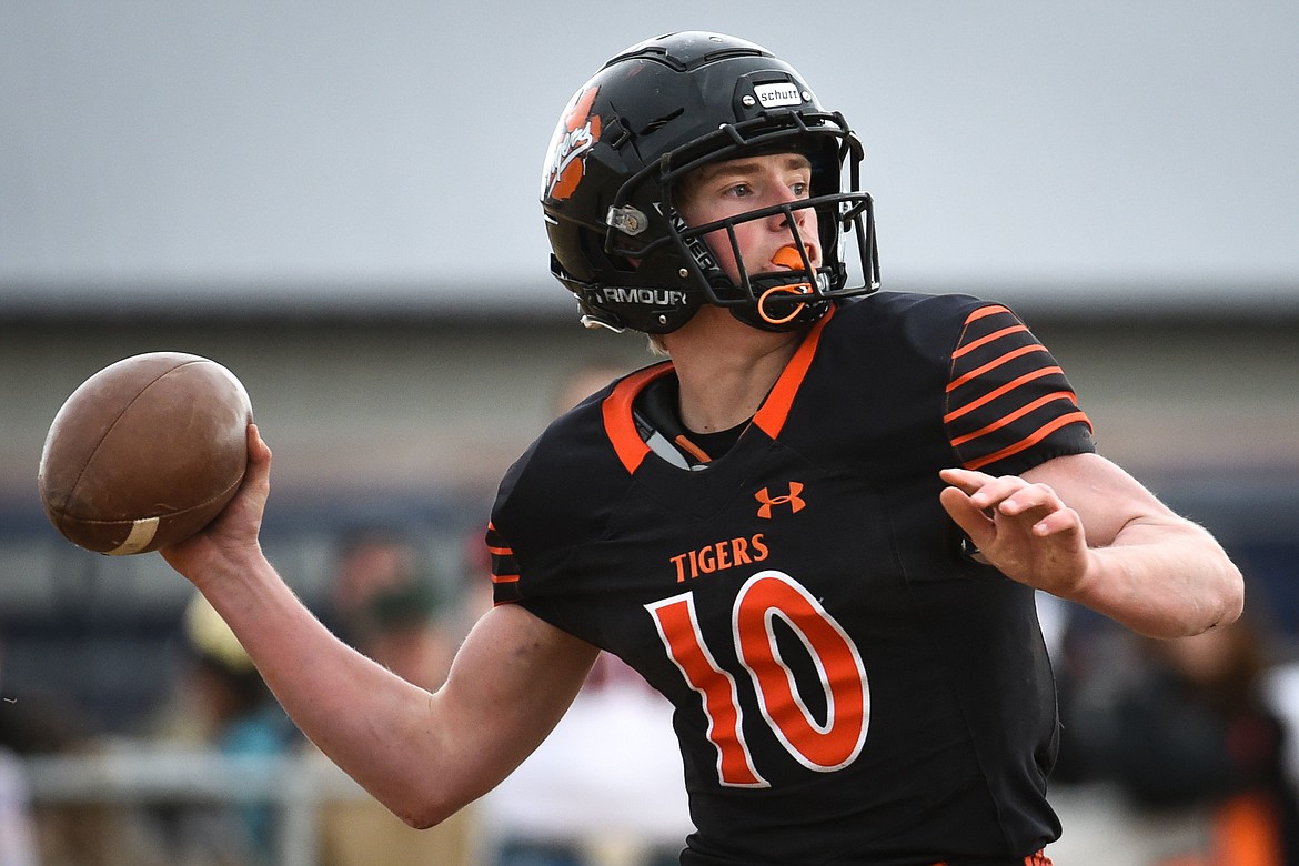 Manhattan quarterback Lane Veltkamp (10) looks to throw against Eureka in the Class B State Championship against Eureka on Saturday. (Casey Kreider/Daily Inter Lake)