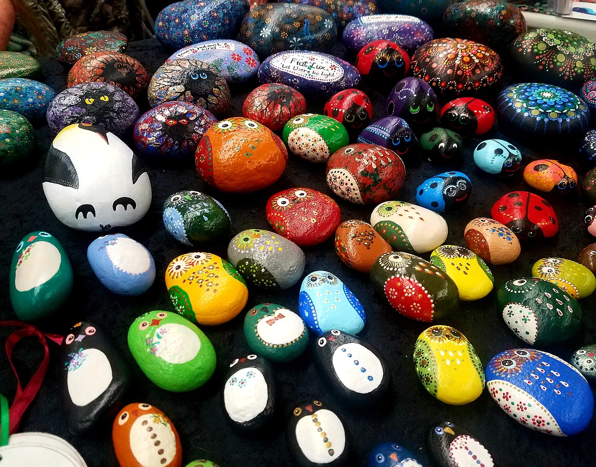 Colorfully painted rocks were displayed for sale at the Lochard family table.