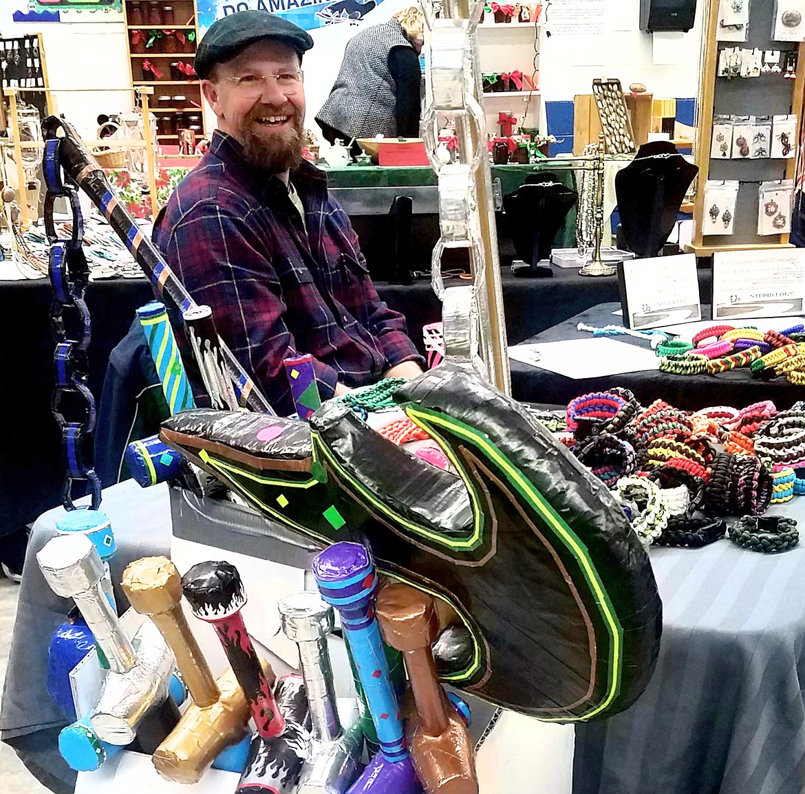 Jim Lochard mans the duct tape weaponry and paracord bracelet table at the market.