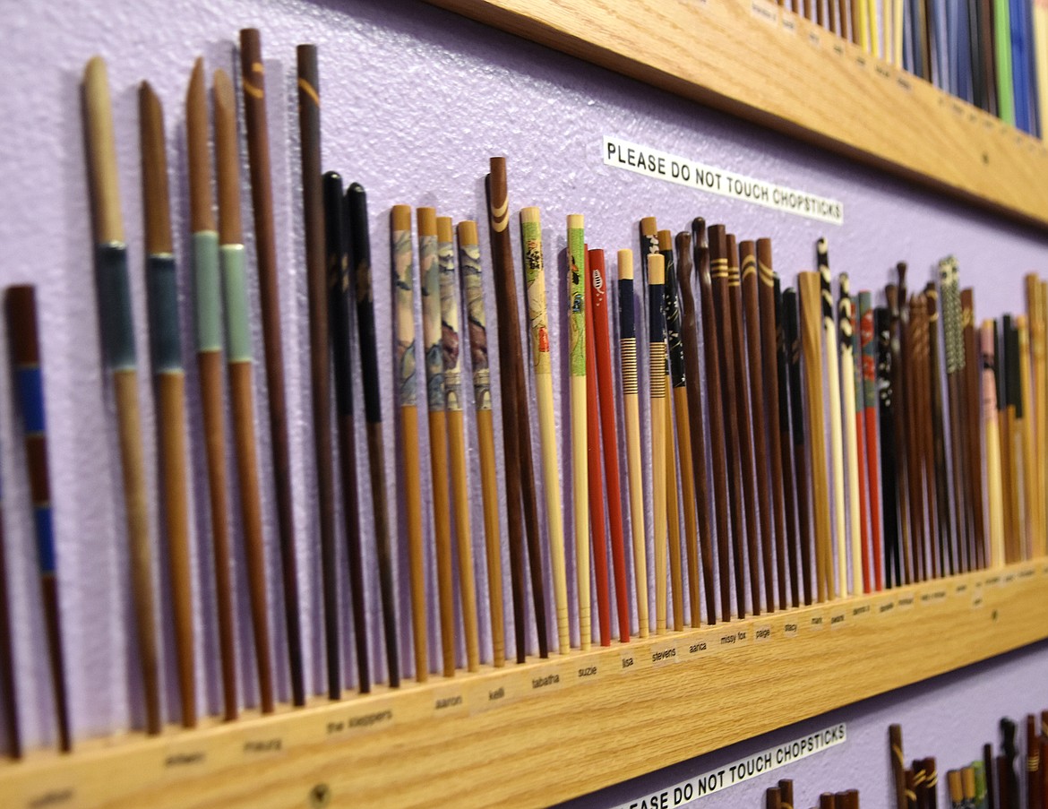 Chopsticks labeled by their customer&#146;s names line the walls of Wasabi Sushi Bar and Ginger Grill in downtown waiting for dinner at the restaurant. It&#146;s one of the testaments to the ways Wasabi has kept its focus on its customers during its 20 years in business. (Heidi Desch/Whitefish Pilot)