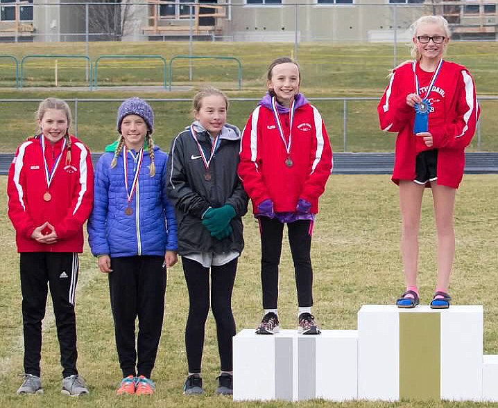 Courtesy photo
Helen Oyler (left, 7th, 12 minutes, 52.60 seconds), Olivia May (second from right, second, 11:56.77) and Cambrie Stam (far right, first, 11:46.54) all placed for North Idaho XC in the U11-12 girls (3,000 meters) race at the USATF Inland Northwest Association Junior Olympic cross country championship on Saturday at Lake City High.