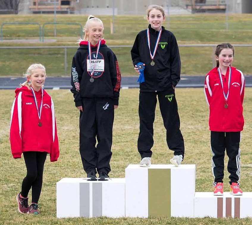 Courtesy photo
Paisley Ray, left, was eighth in 14 minutes, 01.22 seconds; Adalyn Depew, second from left, was second in 12:38.49 and Olivia Abbey, right, was third in 13:04.15 in the U9-10 girls race (3,000 meters) at the USATF Inland Northwest Association Junior Olympic cross country championship on Saturday at Lake City High. All three are from the North Idaho XC team.