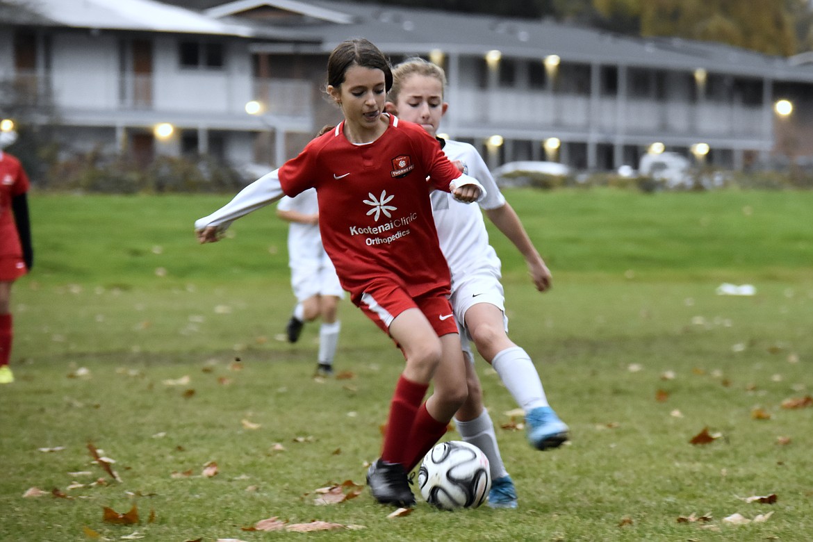 Photo by SUZI ENTZI
The Thorns North FC 08 Girls Red soccer team traveled to the Seattle area this past weekend. On Saturday the Thorns played Reign Academy Pre-Academy in Tukwila, Wash., and tied 3-3. Allison Carrico, Ella Pearson, and Isabella Grimmett each had one goal for the Thorns. On Sunday they played Nortac Sparta in Tacoma, Wash., and lost 3-2. Allison Carrico had 2 goals and Cameron Fischer had an assist for the Thorns. Pictured in red is Isabella Grimmett of the Thorns.