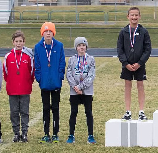 Courtesy photo
Parker Sterling (left, 6th, 11 minutes, 52.07 seconds); Mitchell Rietze (right, 2nd, 11:07.00) and Logan Anderson (not pictured, 3rd, 11:24.08) of the North Idaho XC team placed in the U11-12 boys (3,000 meters) race at the USATF Inland Northwest Association Junior Olympic cross country championship on Saturday at Lake City High.