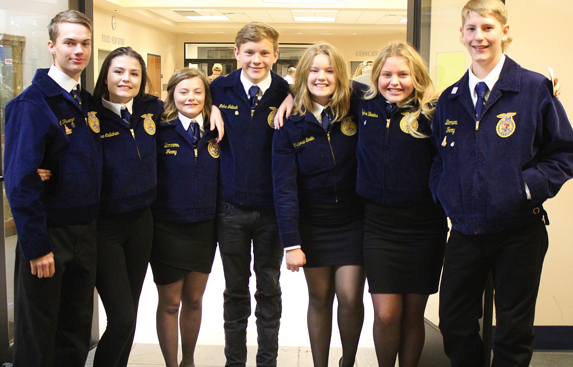 Stationed at the front doors to the event, from left: Trent Freeze, Kirra Callahan, Shyanne Kittell, Cade Jelinek, Katie Smith, Sydney Blevins, and Christian Blevins welcome attendees.