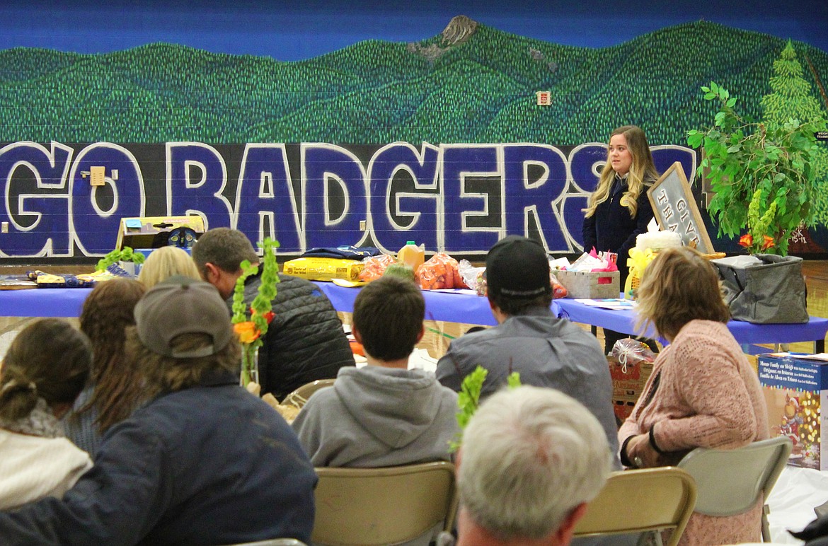 Photos by TONIA BROOKS
Jeannie Pinkerton, secretary for the local Future Farmers of America chapter, tells the crowd during the opening ceremony of Friday&#146;s annual Harvest Auction: &#147;Stationed by the ear of corn, I keep an accurate record of all meetings and correspond with other secretaries wherever corn is grown and FFA members meet.&#148;