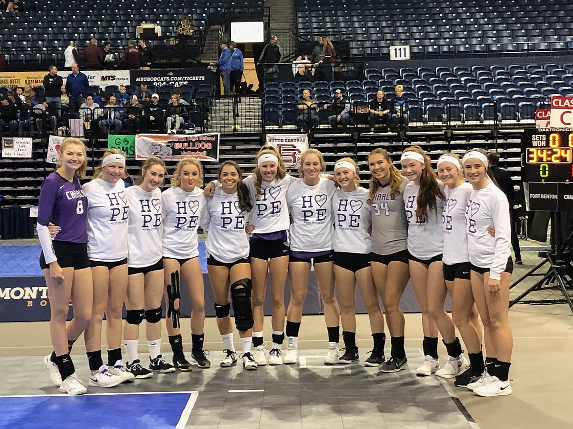 The 2019 Charlo Lady Vikings (23-6) pose on the floor of the Brick Breeden Field House in Bozeman, site of the all-classification state volleyball tournament. The team wore &#147;Hope for Harlee&#148; warmup gear to heighten awareness about the plight of 5-year old Harlee Salmi, who was diagnosed with an aggressive, cancerous brain tumor. Harlee is the daughter of Taylor Salmi, coaching staff member of the Hot Springs Lady Savage Heat volleyball team who has taken a leave of absence as her daughter undergoes treatment.  Pictured (L-R): Kira McPhail, Connor Fryberger, Molly Kate Sullivan, Kassidi Cox, Bella Hawk, Carlee Fryberger, Liev Smith, Katelyn Young, Destiny Manuel, Anneleise DeGrandpre, Brooke Alder, Hayleigh Smith. (Photo courtesy of Rhondell Volinkaty)