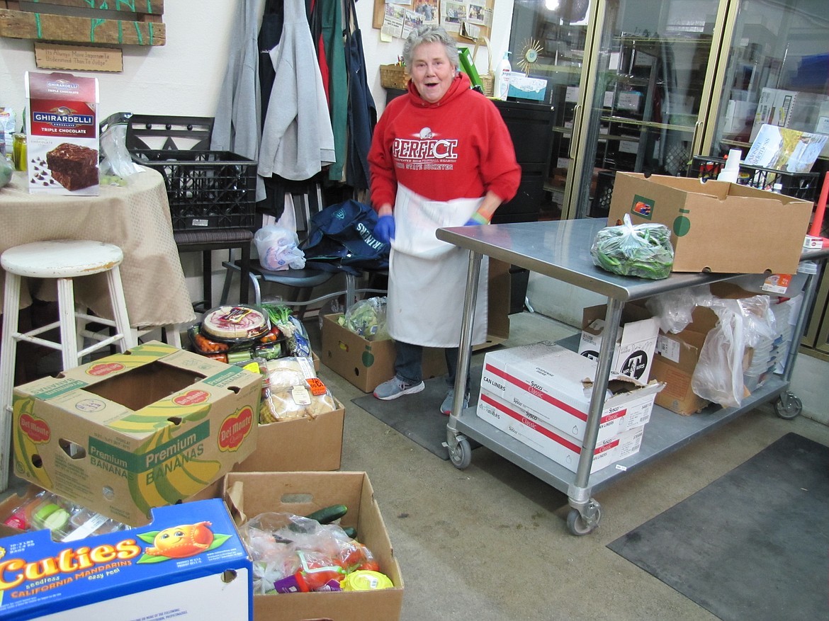 Ann Sidner, Post Falls food bank volunteer, gets ready to unpack produce.