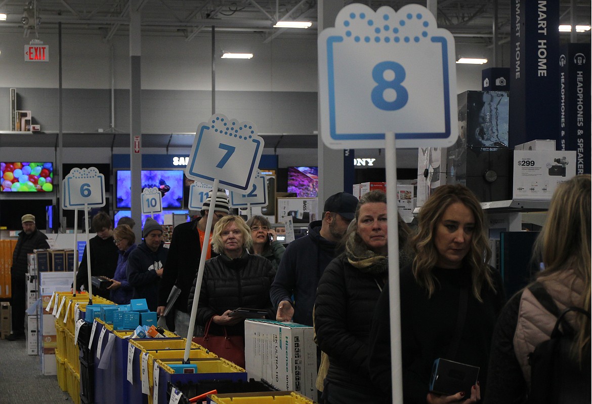 Shoppers wait in line for their turn to capitalize on Black Friday deals at Best Buy in Coeur d&#146;Alene. General manager Jon Olson described numbers from this year&#146;s annual holiday tradition as &#147;explosive,&#148; adding the shopping process was seamless and organized for electronics consumers this holiday season. (CRAIG NORTHRUP/Press)