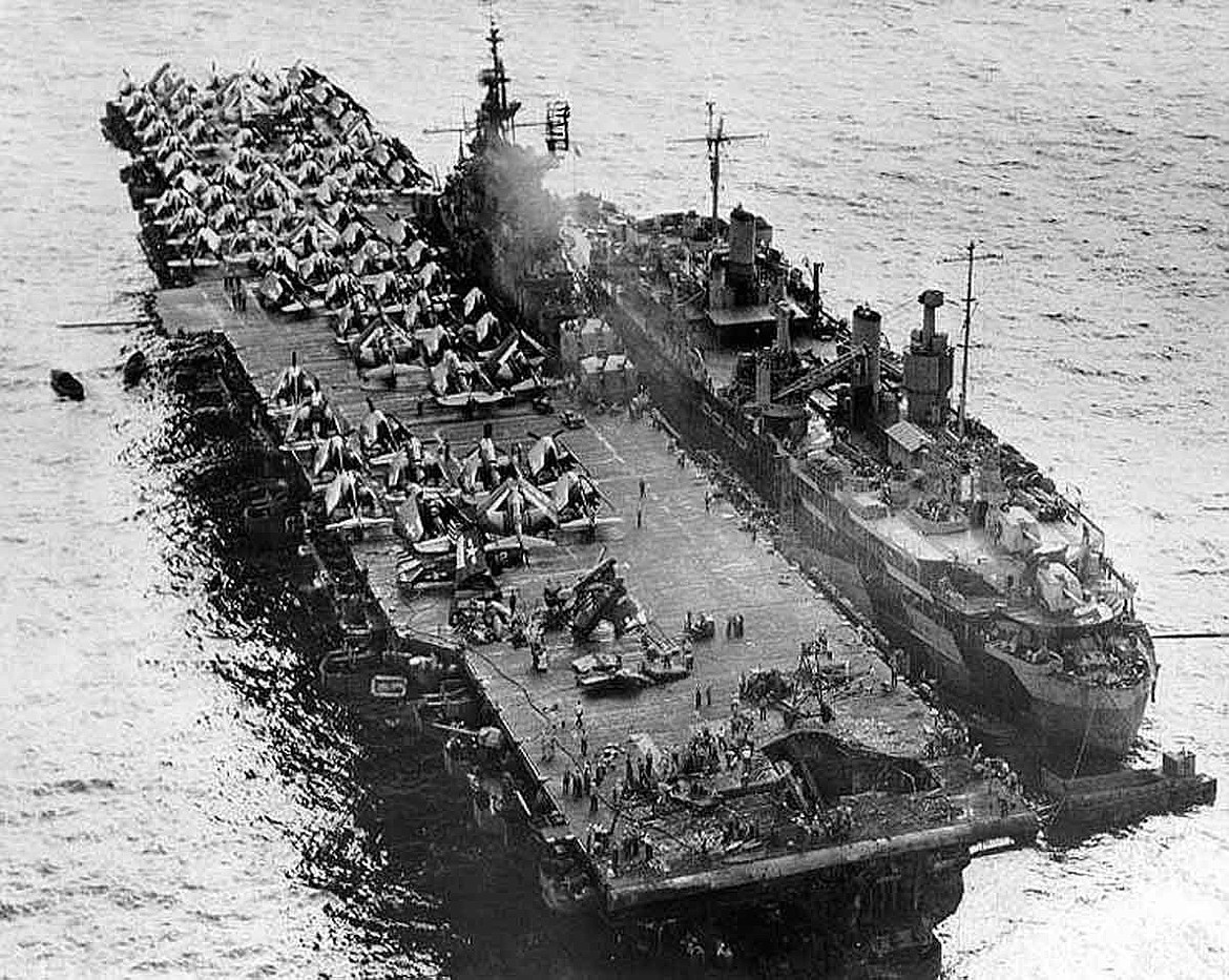 U.S. NAVY PHOTO
Aircraft carrier USS Randolph (CV-15) shown here alongside repair ship USS Jason (ARH-1) at Ulithi Atoll in mid-Pacific undergoing repairs of the aft section hit by a Kamikaze (1945).