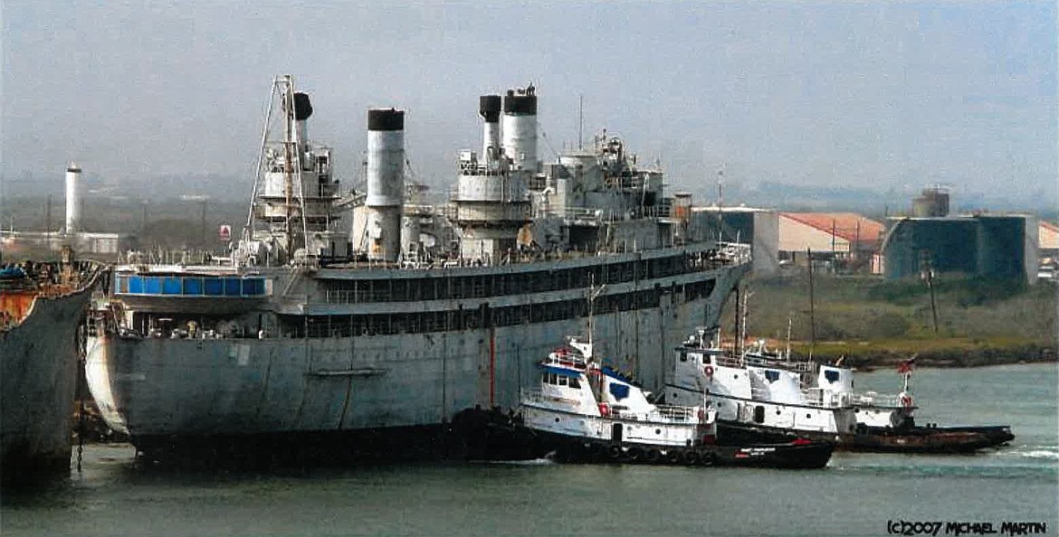 PHOTO BY MICHAEL MARTIN
Signet Marine tugboats position USS Jason at Marine Metals Inc. in Brownsville, Texas, to be scrapped after being towed from San Francisco Bay (2007).