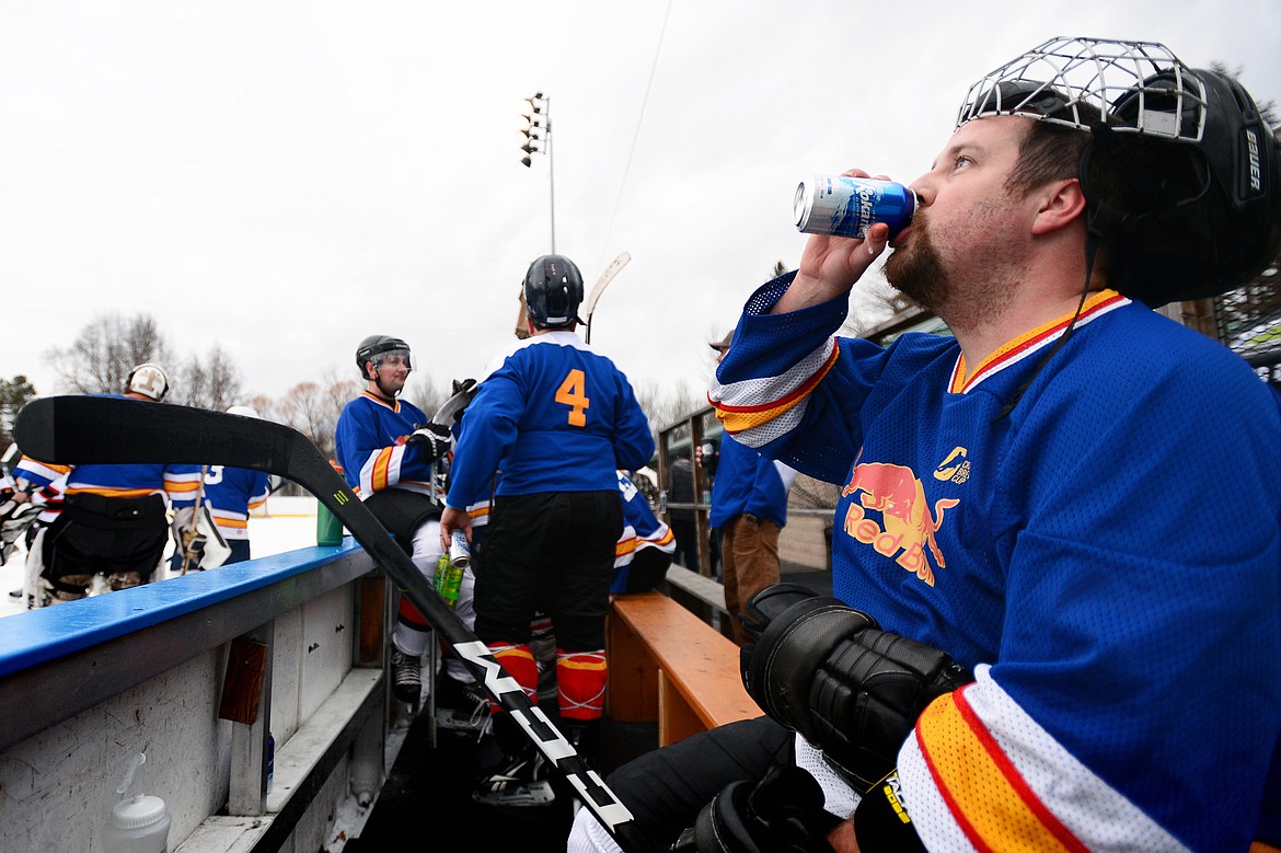 Kevin Durkin, of the Fun Beverage team from Kalispell, takes a sip from a beer during a break in play against Village Brewery during the Craft Brewers Cup at the Woodland Park Ice Center on Friday. The Craft Brewers Cup is the largest fundraiser of the year for the Flathead Valley Hockey Association. The tournament continues Saturday with games starting at 7 a.m. along with a brewfest from noon to 8 p.m. Seven local breweries will be in attendance Saturday with nearly 20 beers on tap.  (Casey Kreider/Daily Inter Lake)