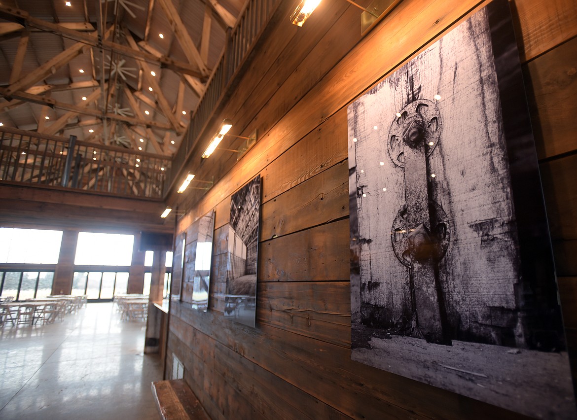 The walkway into Snowline Acres is lined with black and white architectural details of the original Kalispell Lumber building.