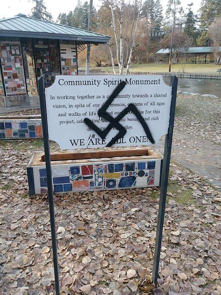 BLACK SWASTIKAS were spray-painted on the sign at the Community Spirit Monument in Woodland Park. (Photo Scott Brown)