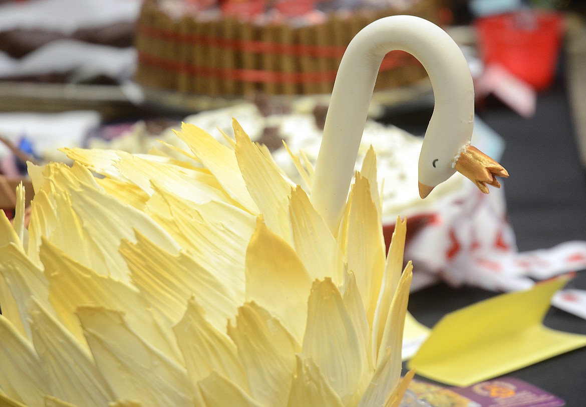 A gluten-free chocolate swan cake by Grateful Bread Bakery and Cafe of Bigfork was awarded first place for appearance in the professional cakes and tortes category and won the Best of Show award at the Chocolate Extravaganza hosted by the Flathead County Republican Women on Tuesday at the Red Lion in Kalispell. (Matt Baldwin/Daily Inter Lake)