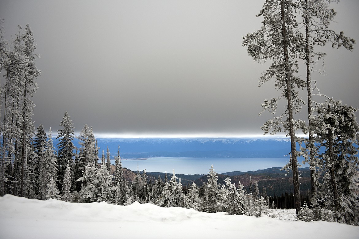 Snow and ice cling to trees in a view of Flathead Lake from Blacktail Mountain Road on Wednesday.