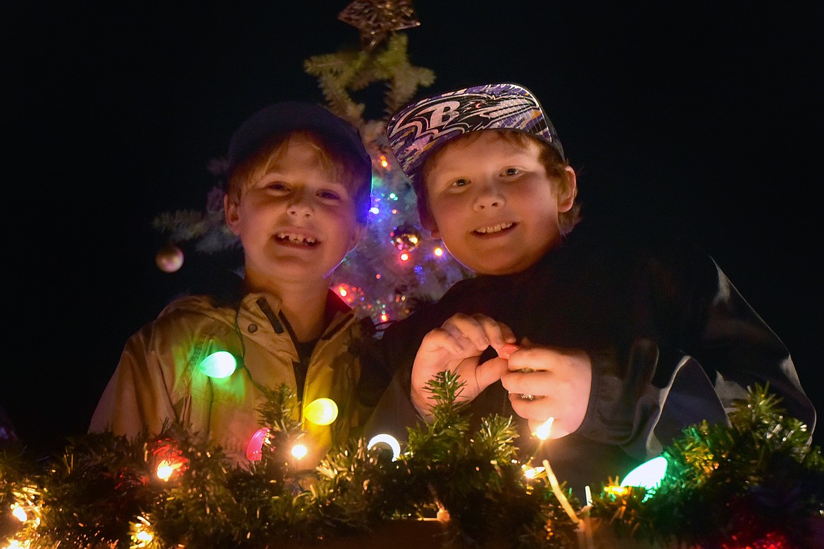 Kayl Howell and Delsen Opalka represent the Boy Scouts of America on their float. (Jeremy Weber photo)