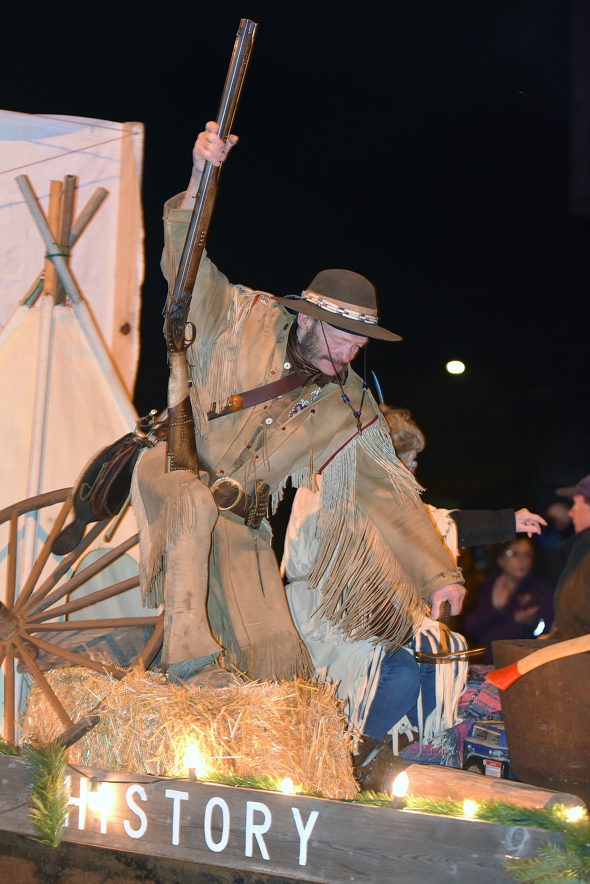 Stu Sorensen from the Columbia Falls Historical Society uses his hammer to ring the kettle. (Jeremy Weber photo)