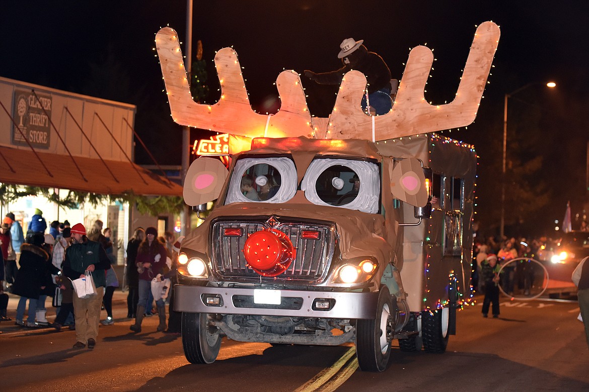 The Flathead  National Forest Service &#147;Rudolph&#148; truck carries Smokey Bear down Nulceus Avenue. (Jeremy Weber photo)