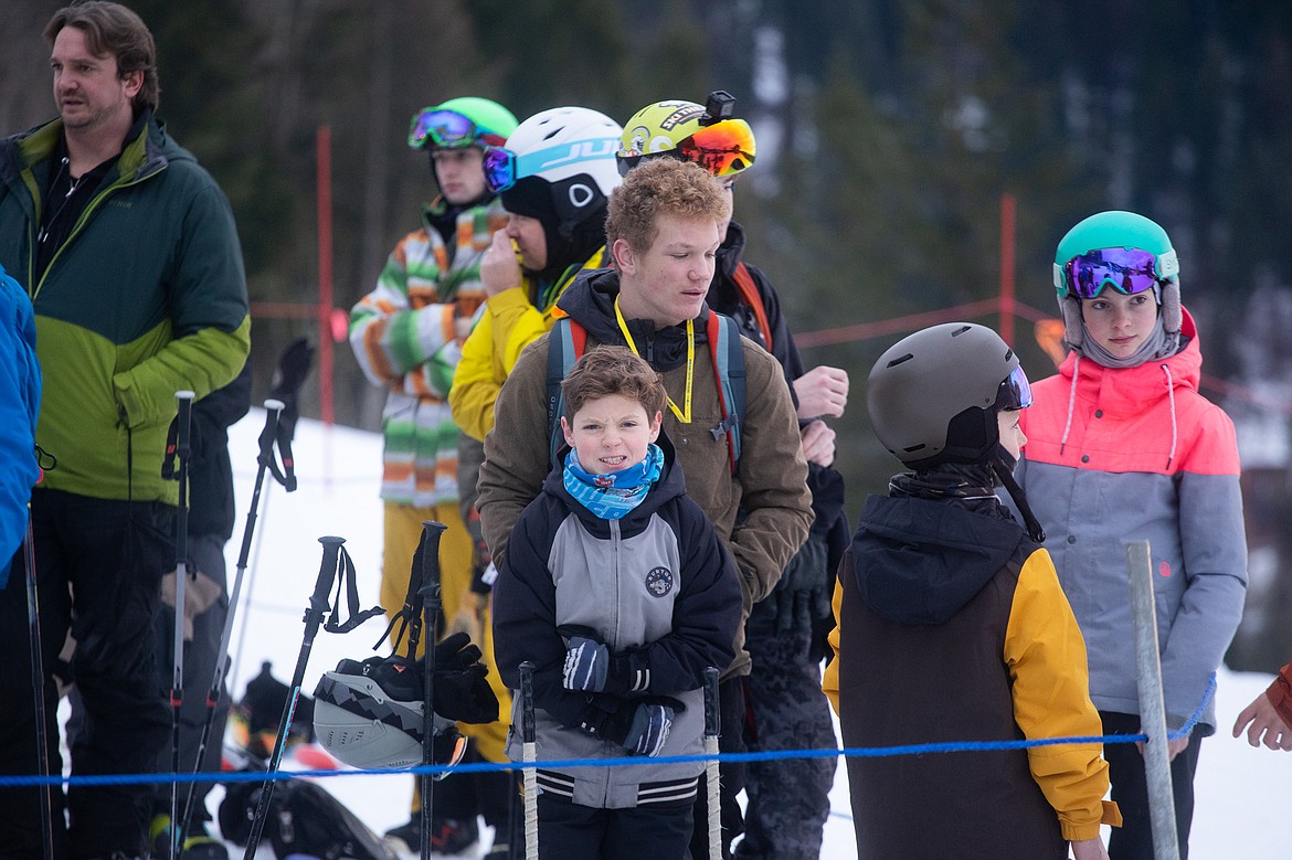 A young skier flexes his muscles on opening day at Whitefish Mountain Resort. (Daniel McKay/Whitefish Pilot)