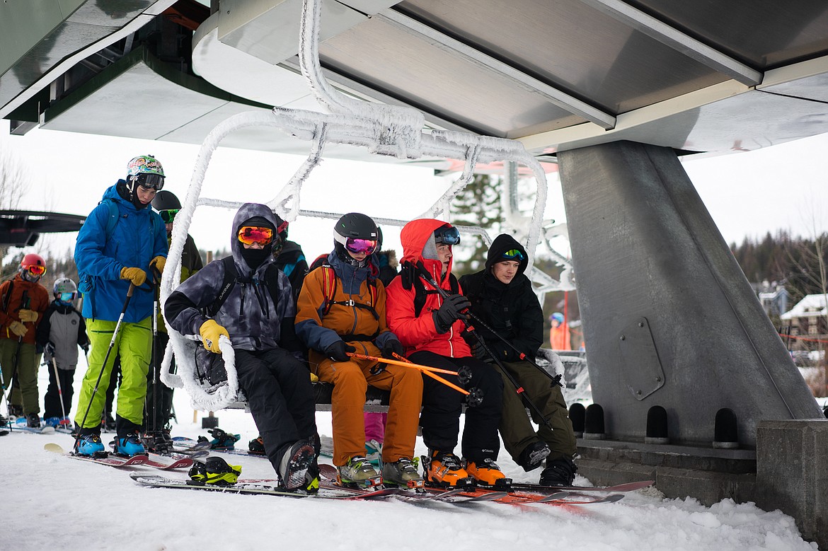 The first four head up to the summit on opening day at Whitefish Mountain Resort. (Daniel McKay/Whitefish Pilot)