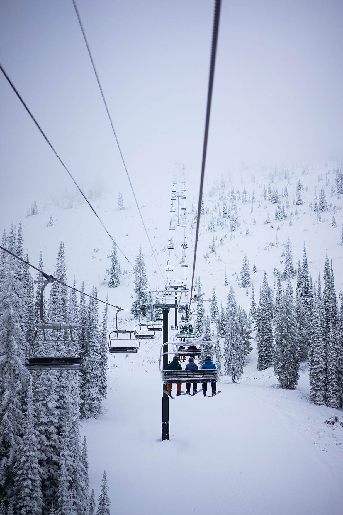 Skiers young and old waited for the first lift rides of the season at Whitefish Mountain Resort, which opened today. (Daniel McKay/Whitefish Pilot)