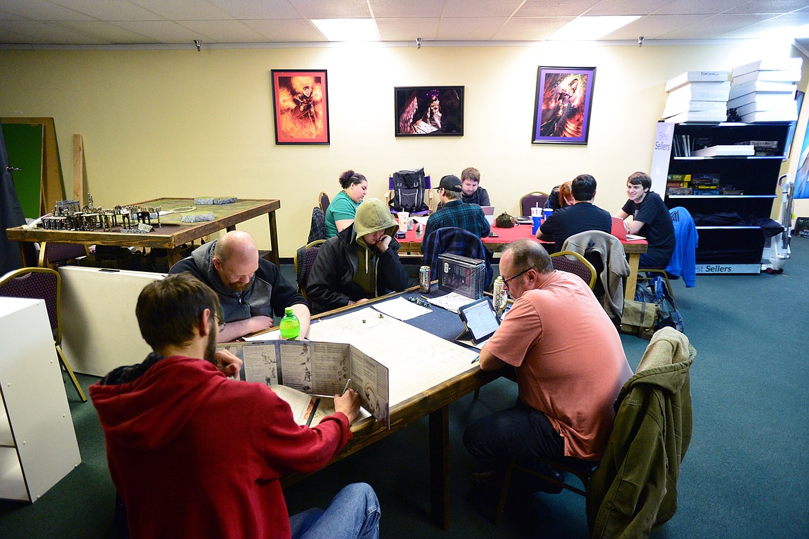 Gamers play Dungeons &amp; Dragons at Heroic Realms Hobbies &amp; Games in Evergreen on Thursday, Nov. 14. (Casey Kreider/Daily Inter Lake)